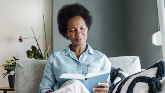 woman reading on a couch